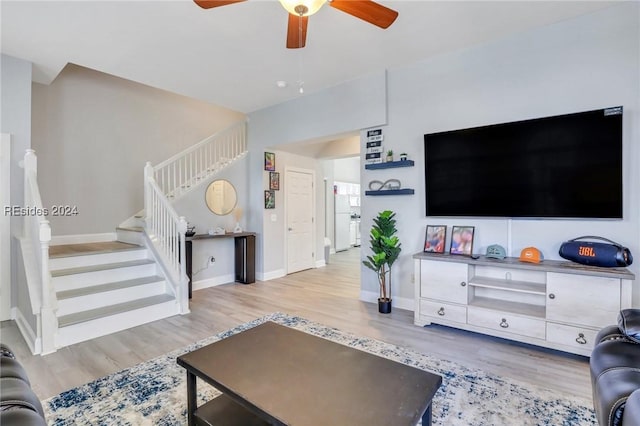 living room with ceiling fan and light wood-type flooring