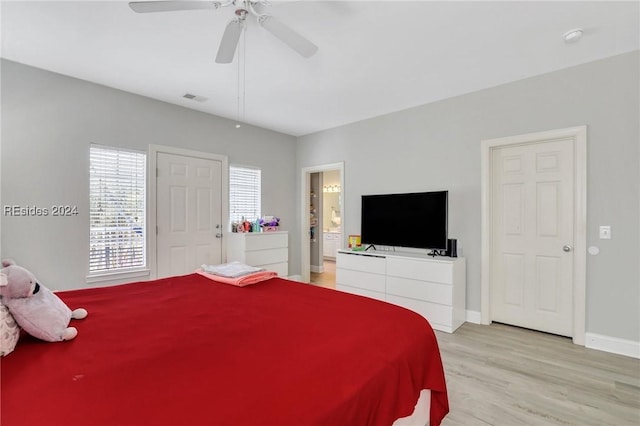 bedroom with light wood-type flooring and ceiling fan