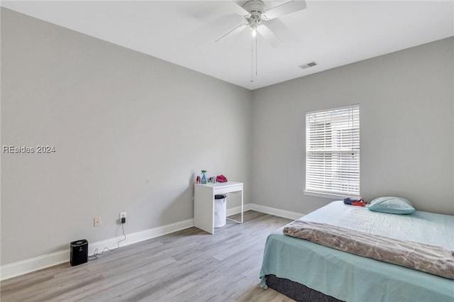 bedroom featuring ceiling fan and light hardwood / wood-style floors