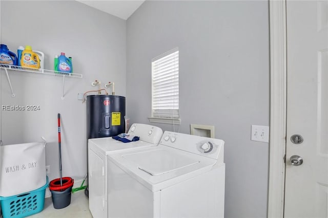 clothes washing area featuring washing machine and dryer and electric water heater