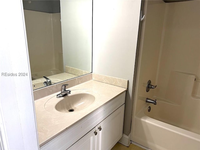 bathroom featuring vanity and shower / tub combination