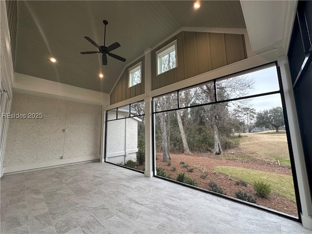 unfurnished sunroom featuring lofted ceiling and ceiling fan