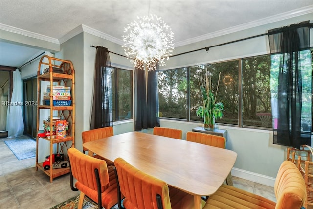 dining room featuring a notable chandelier, ornamental molding, and a textured ceiling