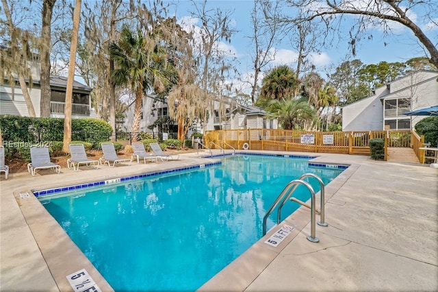 view of swimming pool with a patio area