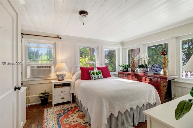 bedroom featuring multiple windows, cooling unit, and wood ceiling