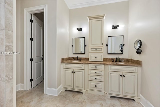 bathroom with vanity and ornamental molding