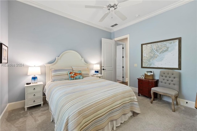 carpeted bedroom with ornamental molding and ceiling fan