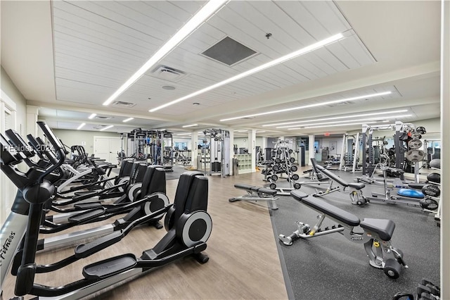 workout area featuring light wood-type flooring