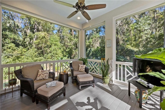 sunroom / solarium with ceiling fan