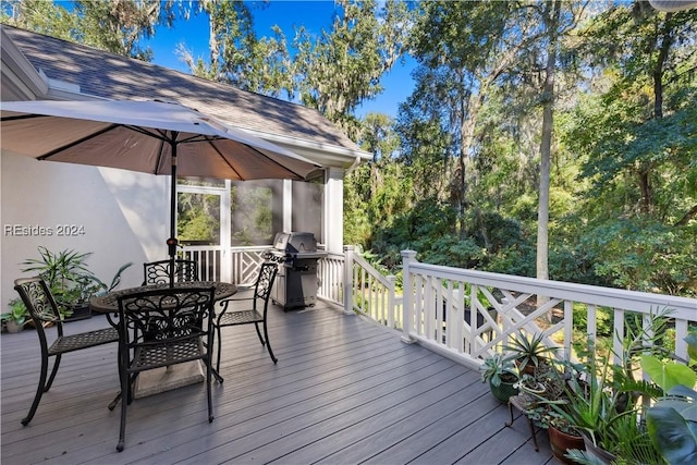 wooden deck featuring grilling area