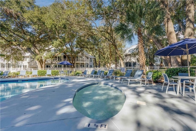 view of swimming pool with a patio area