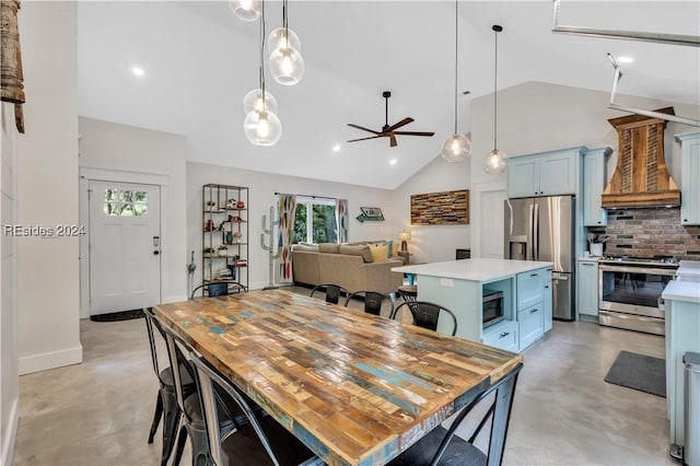 dining space featuring high vaulted ceiling and ceiling fan