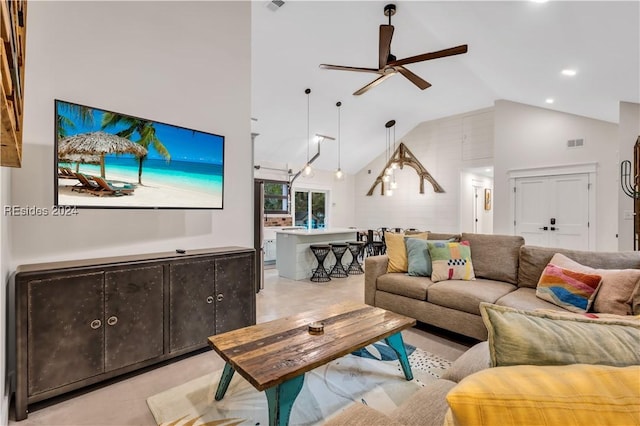 living room featuring high vaulted ceiling and ceiling fan