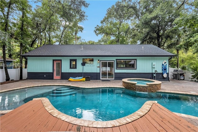 view of swimming pool featuring an in ground hot tub, area for grilling, and a patio