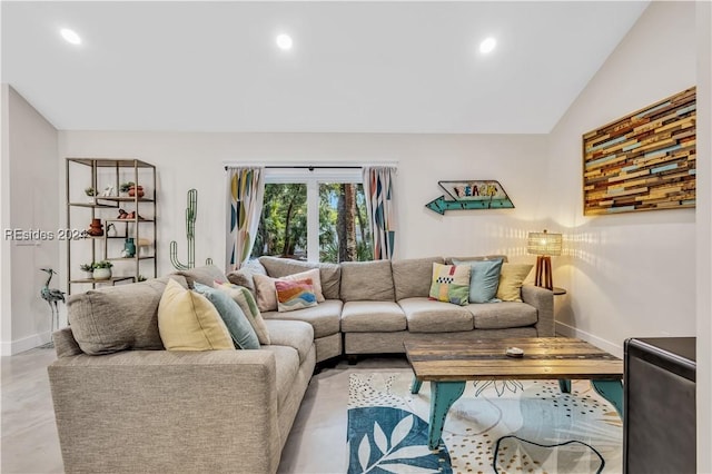 living room featuring vaulted ceiling