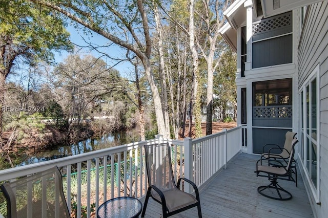 wooden terrace with a water view