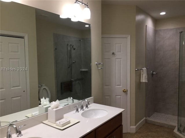 bathroom featuring walk in shower, tile patterned floors, and vanity