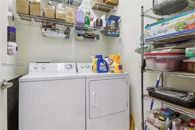 washroom with washer and dryer