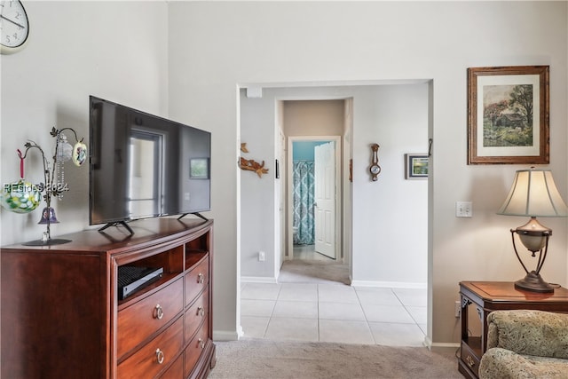 hallway featuring light tile patterned floors