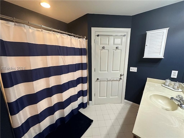 bathroom featuring tile patterned floors, vanity, and curtained shower