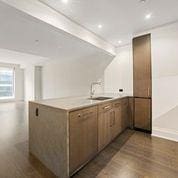 kitchen with dark hardwood / wood-style flooring and sink