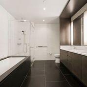 bathroom with tile floors, toilet, and vanity