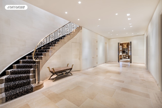 stairs with light tile floors