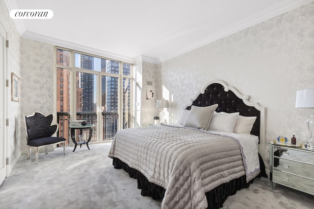 bedroom with carpet floors, crown molding, and expansive windows