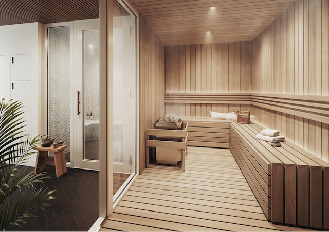 view of sauna featuring wood walls and wood-type flooring