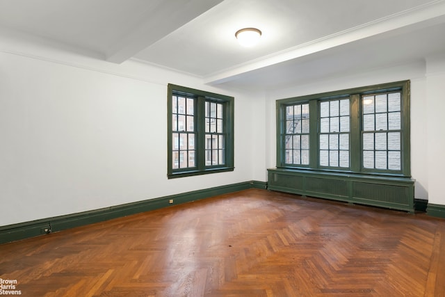 empty room featuring beam ceiling and dark parquet floors