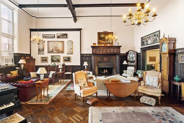 living area featuring beamed ceiling, dark parquet flooring, a towering ceiling, and an inviting chandelier