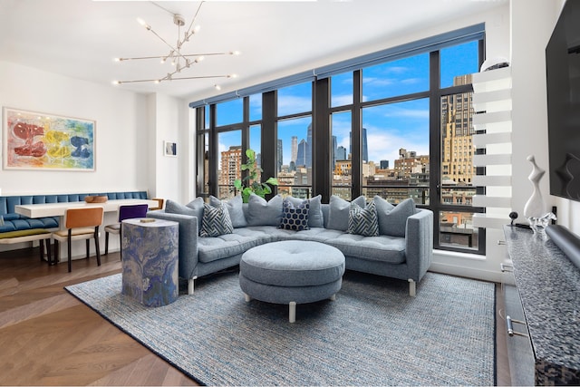 living room with dark parquet floors and a chandelier