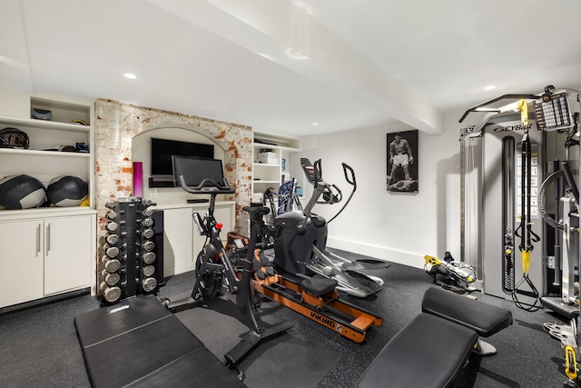 workout room featuring dark carpet