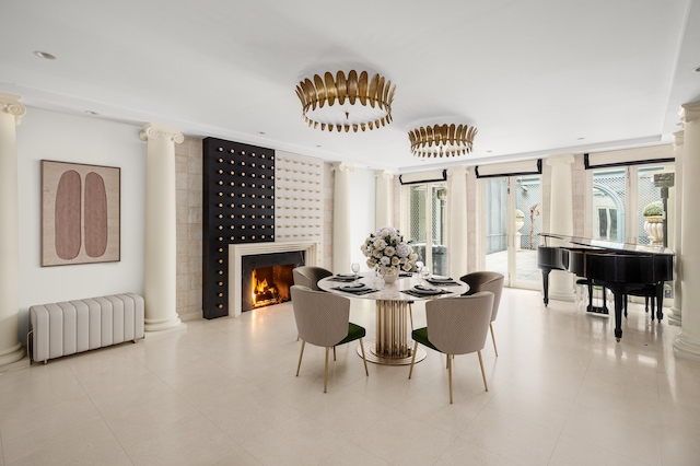 interior space featuring ornate columns and light tile floors