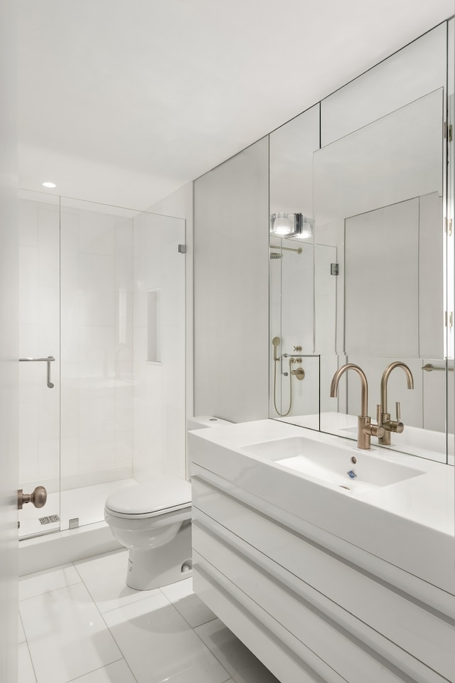 bathroom featuring tile floors, vanity, toilet, and walk in shower