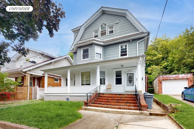 view of front of house featuring a front lawn, an outdoor structure, covered porch, and a garage