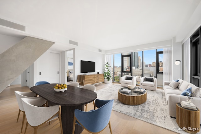 living room with light hardwood / wood-style floors