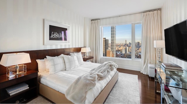 bedroom featuring dark hardwood / wood-style floors