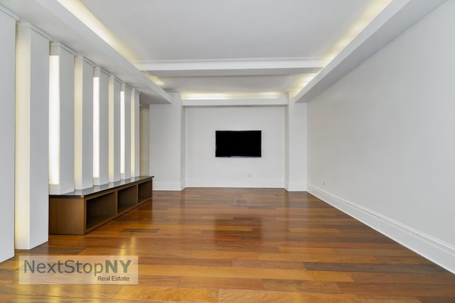 unfurnished living room with hardwood / wood-style floors