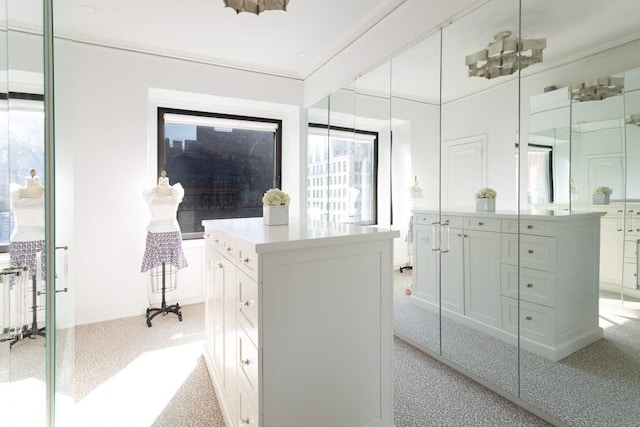 interior space featuring a chandelier and carpet floors