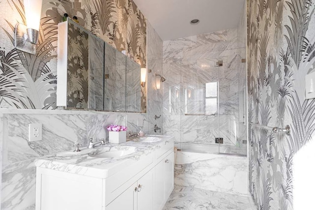 bathroom featuring vanity and a shower with shower door