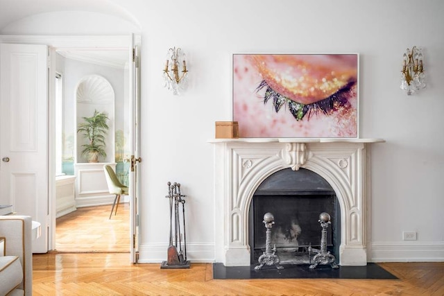 details featuring parquet floors and crown molding