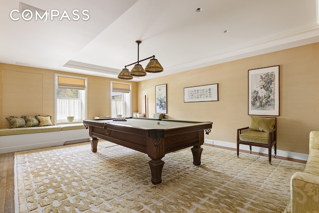 rec room featuring billiards, ornamental molding, and a tray ceiling