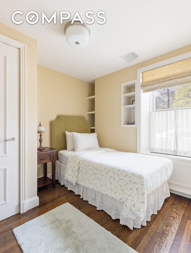 bedroom featuring dark hardwood / wood-style floors