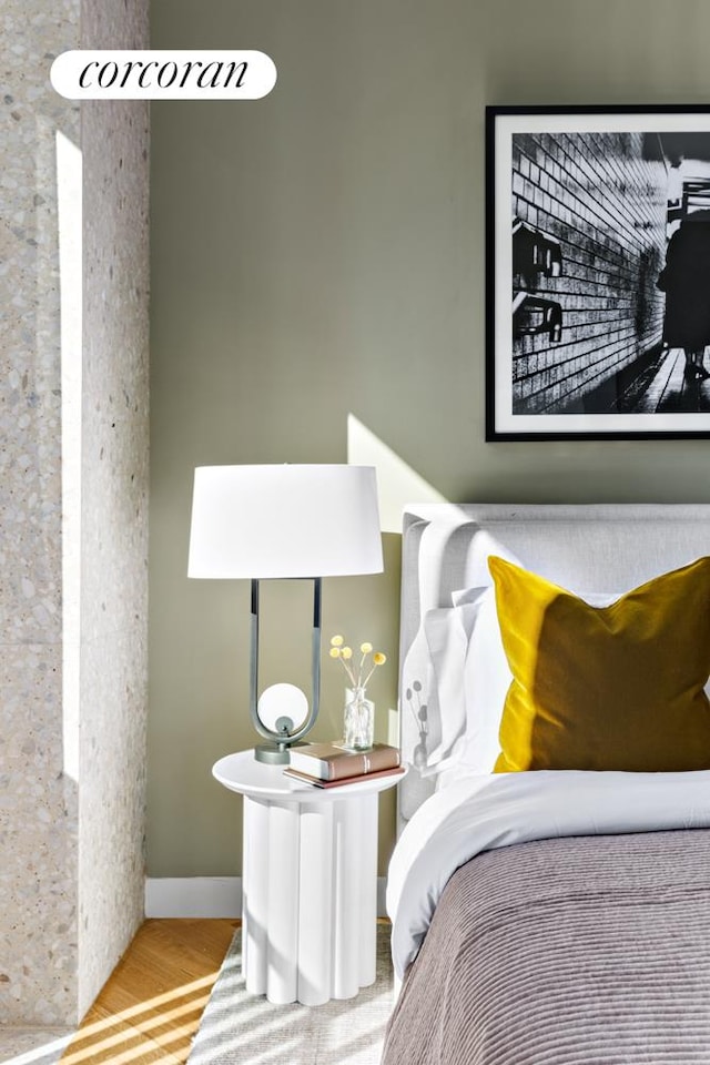 bedroom with wood-type flooring