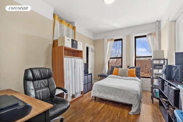 bedroom featuring hardwood / wood-style floors