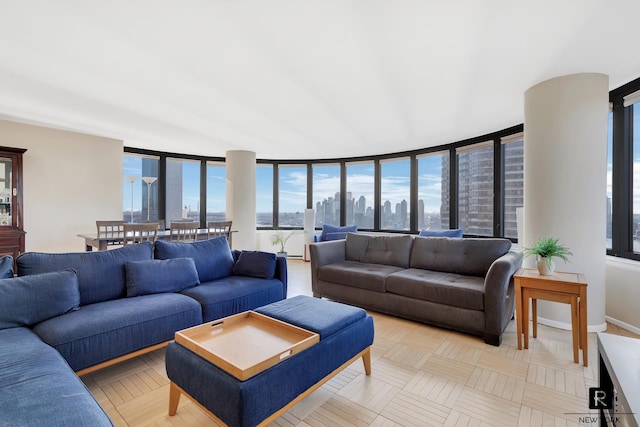 tiled living room with a wall of windows