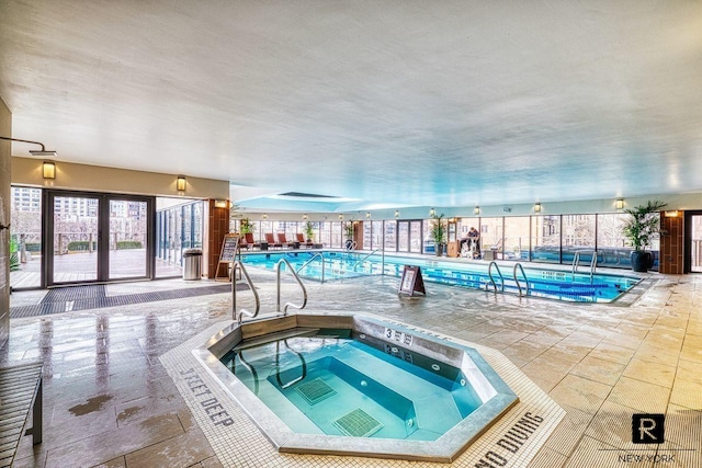 view of pool with an indoor in ground hot tub