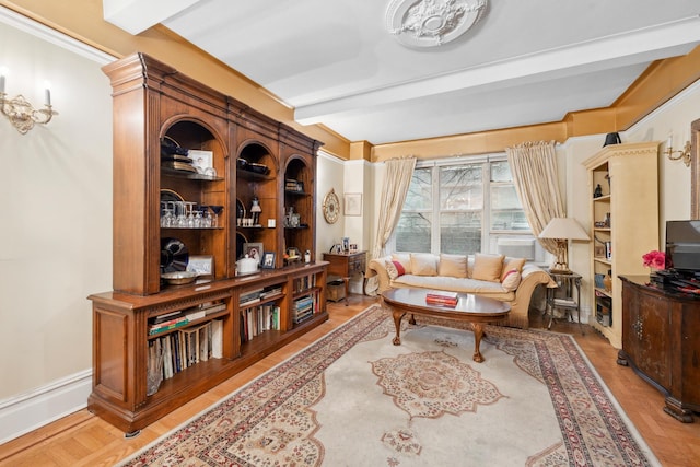 living area with beam ceiling and light parquet floors