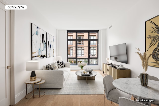 living room with light hardwood / wood-style floors